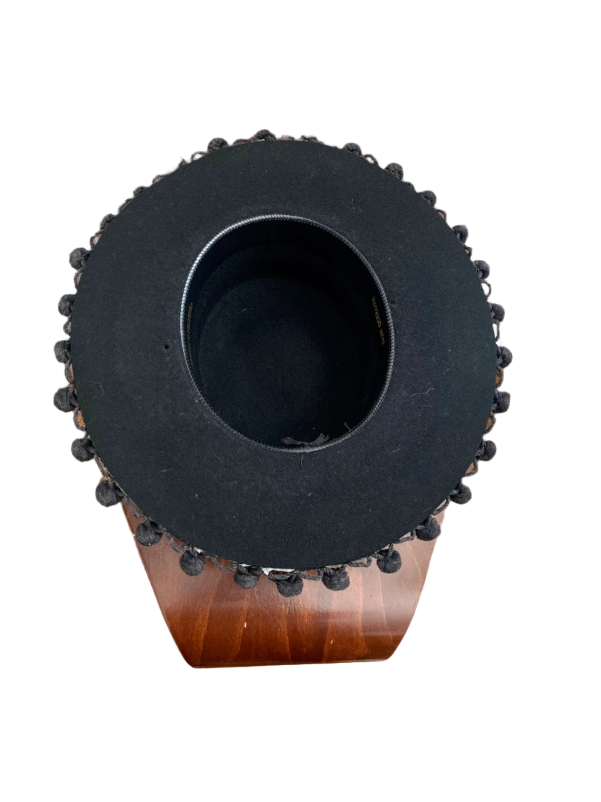 Underside of the black Boater Hat with Pom Poms