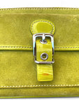 Image 3 (Close-Up of Buckle):
Close-up of the Coach wristlet front pocket with patent leather buckle strap and minor mark on the buckle.