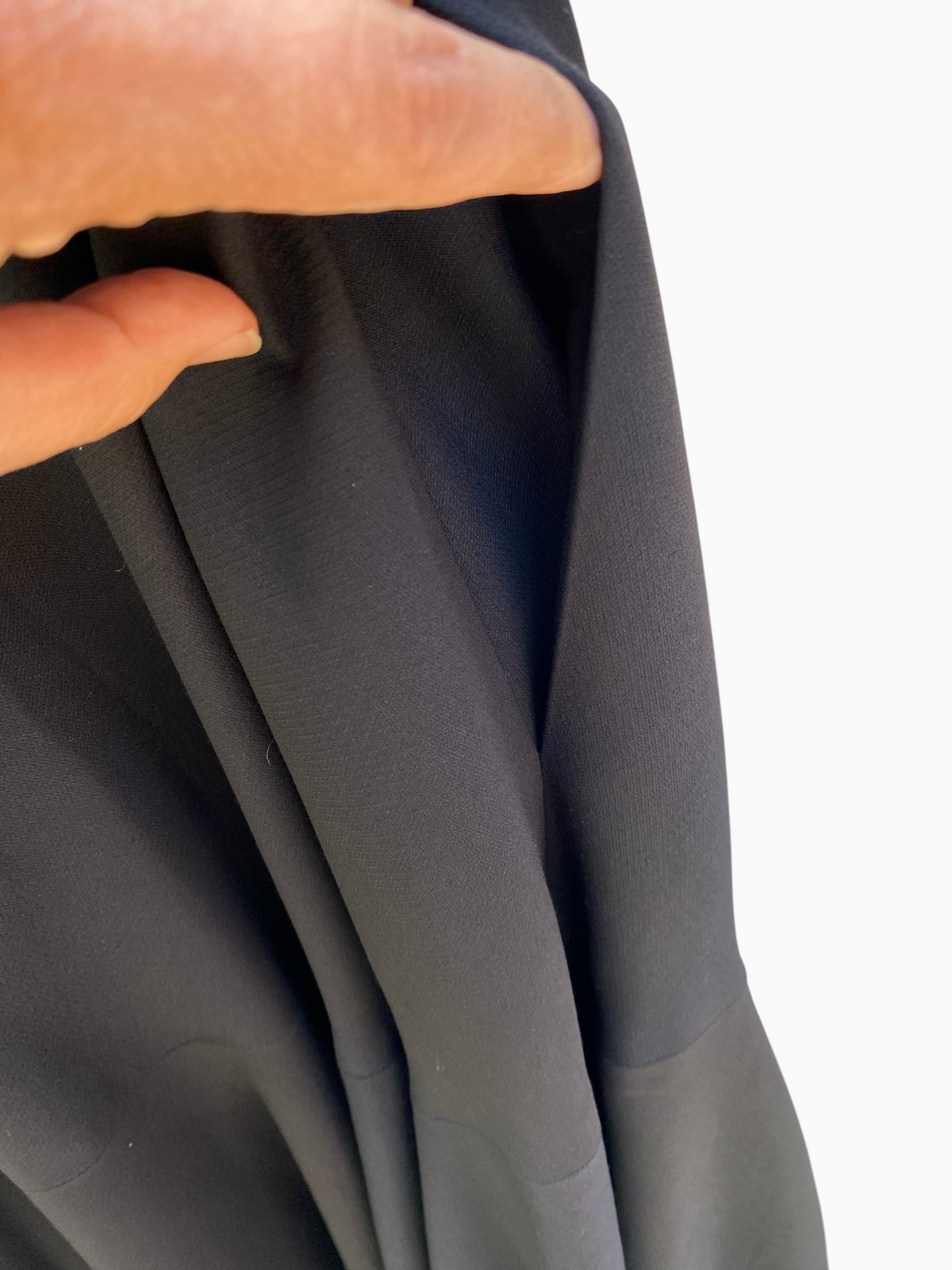 LaliSimone Valentino black wool silk Crepe Couture gown showing the deep side pocket detail and fabric texture