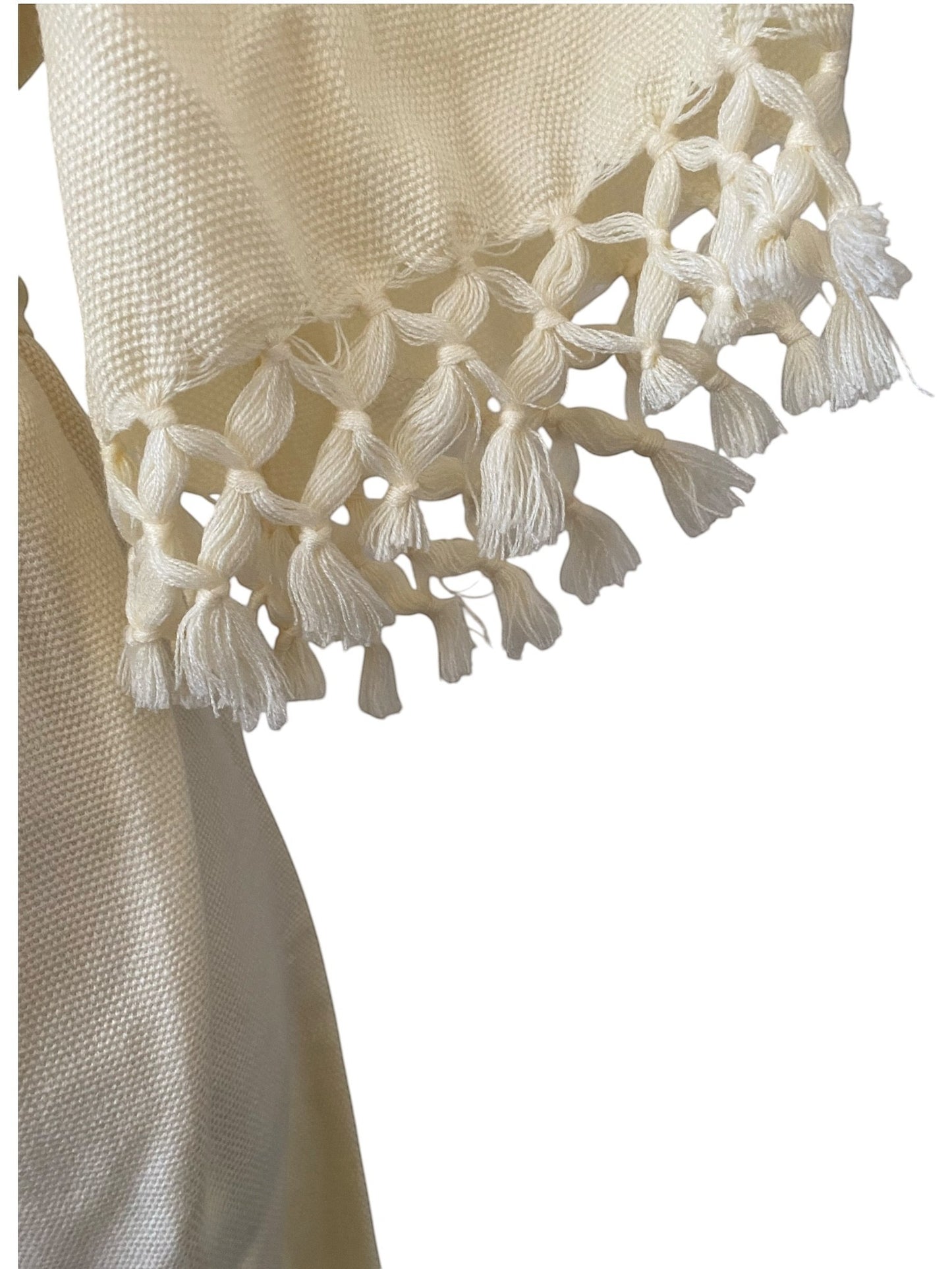 LaliSimone cream boho dress with belt featuring tassel trim on sleeves and textured fabric.