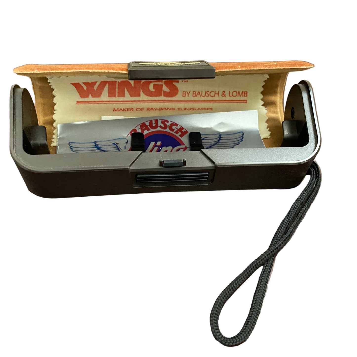 Vintage Bausch & Lomb Wings razor with a strap on a white background