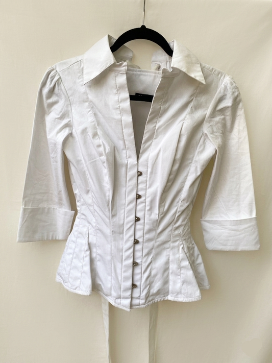 Corsetted white poplin shirt — front view showing crisp fabric and clean silhouette