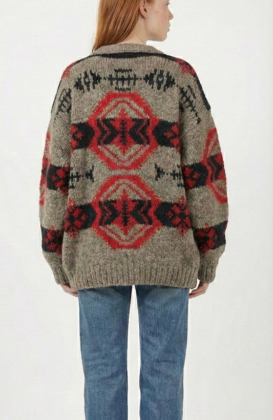 Person wearing a 80s Banana Republic southwestern patterned sweater and jeans on a white background - back of the sweater