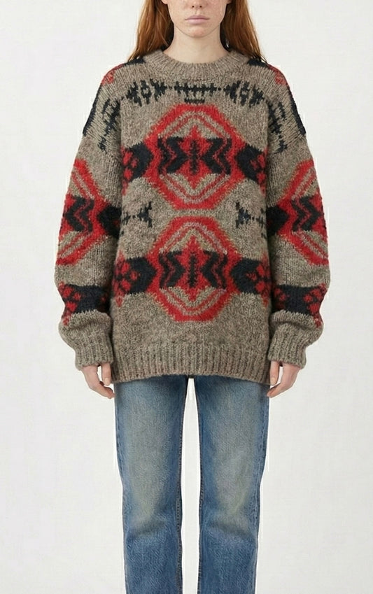 Person wearing a 80s Banana Republic southwestern patterned sweater and jeans on a white background
