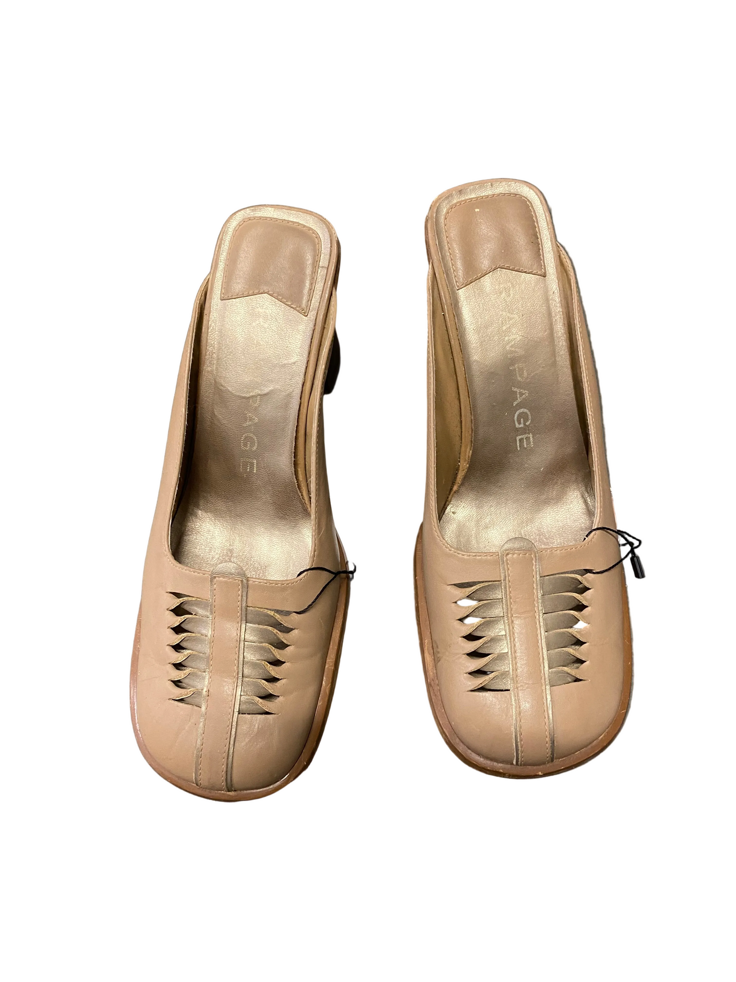 Pair of beige leather shoes with cut-out design on a white background