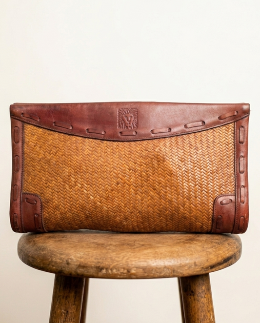 Anne Klein woven leather clutch — front view, brown textured weave pattern with structured silhouette