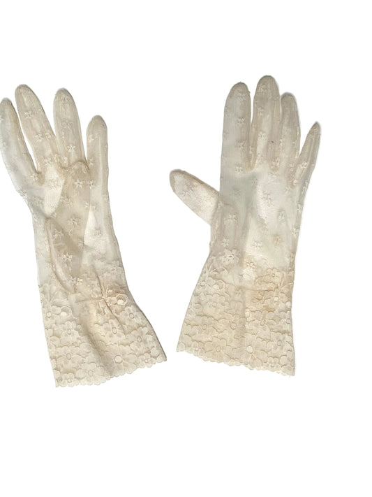 A pair of long, sheer white gloves with delicate lace detailing on the back of the hands and cuffs, laid flat on a white background.