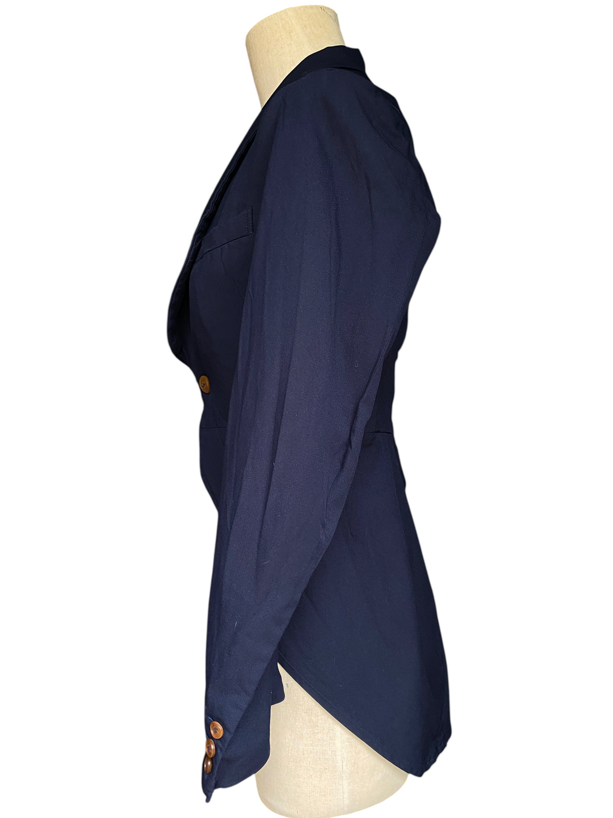 LaliSimone navy COMME des GARÇONS tailcoat jacket with shawl collar, wood button, and cutaway tails on a mannequin