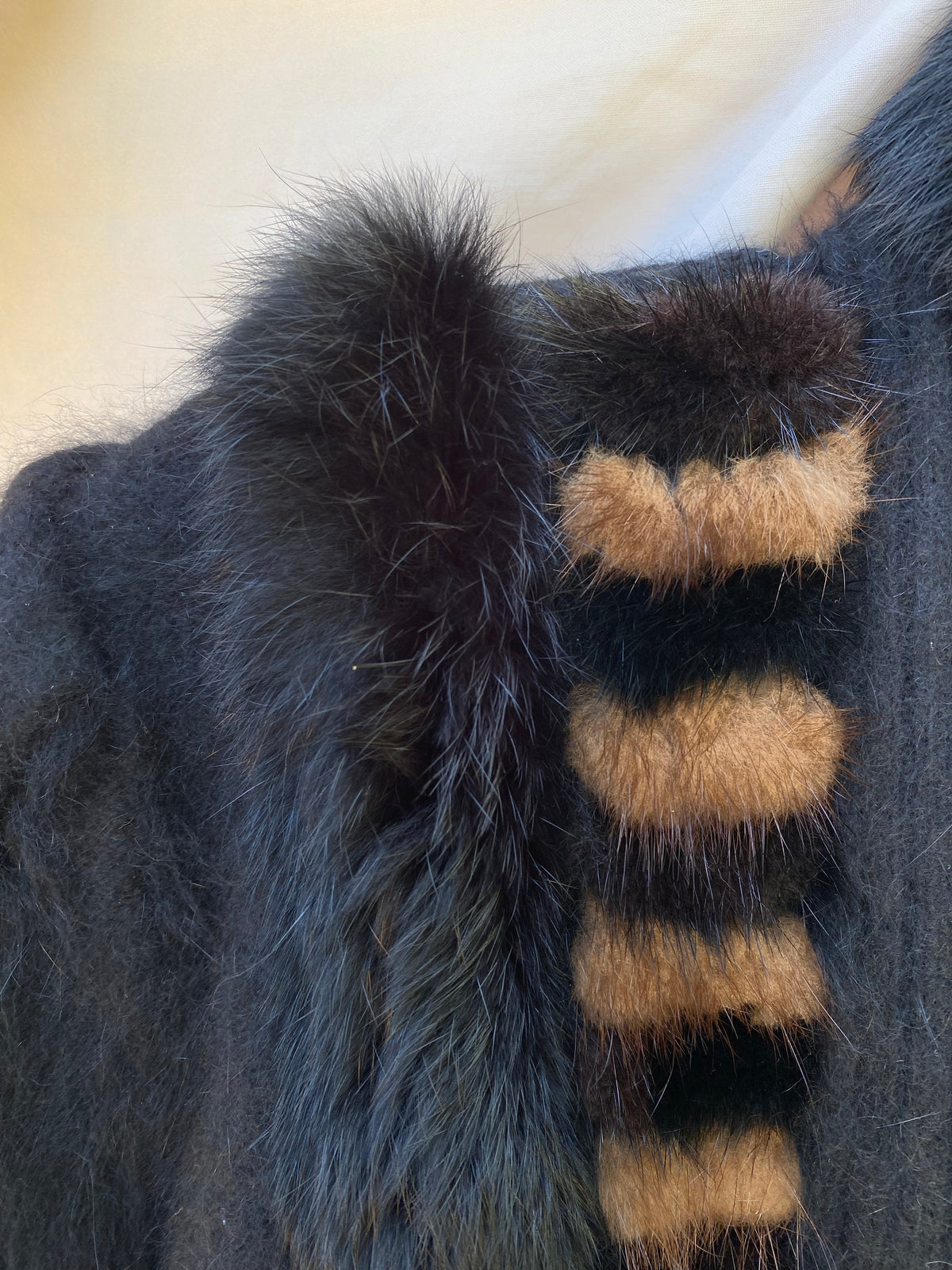Close-up of the rabbit fur collar and tan and brown striped fur trim