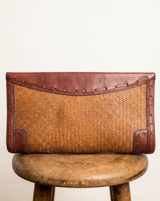 Anne Klein woven leather clutch — side angle view showing depth and leather accents