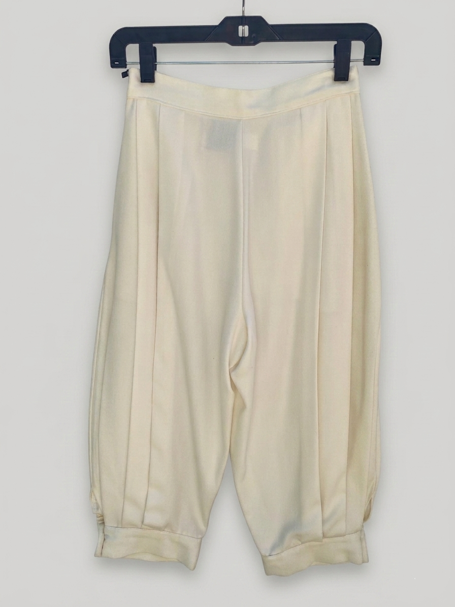 Ivory pleated knickers — side view showing silhouette and cropped hem