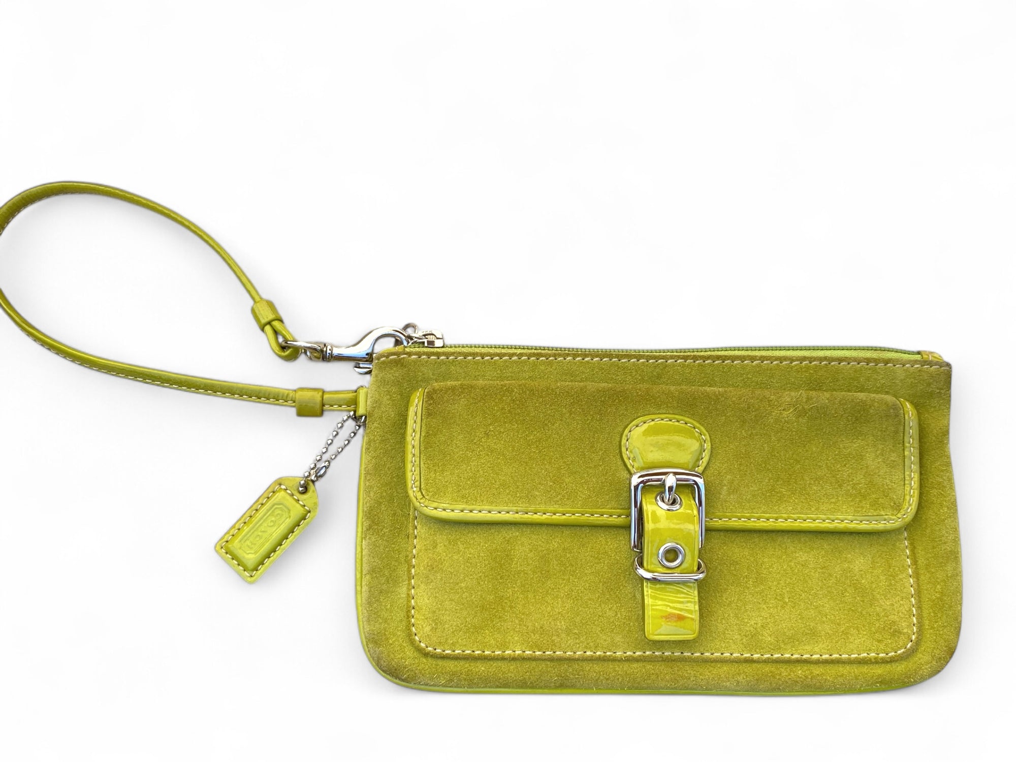 Image 2 (Top View with Strap):
Top-down view of Coach lime green suede wristlet with wrist strap and buckle-front pocket, including Coach tag detail.