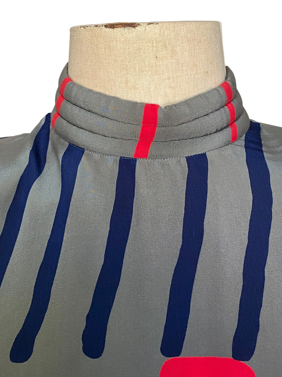 LaliSimone 1980s vintage silk dress featuring a gray stand collar with coral and navy striped graphic print details.