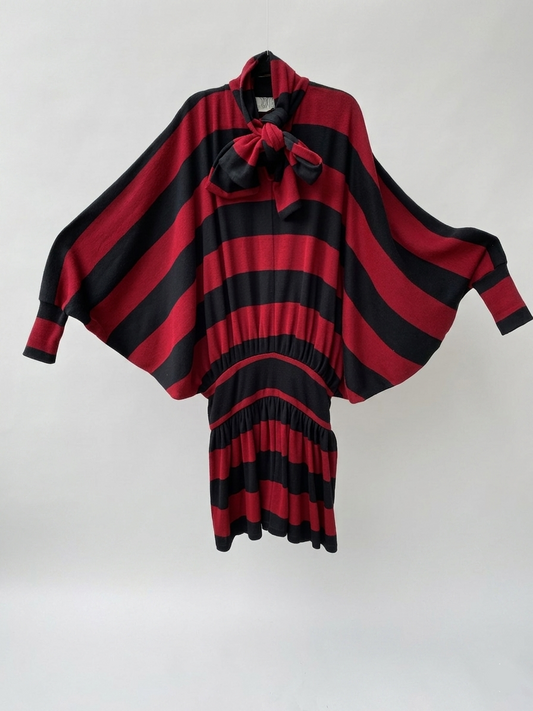 Red and black striped dress with a bow on a white background