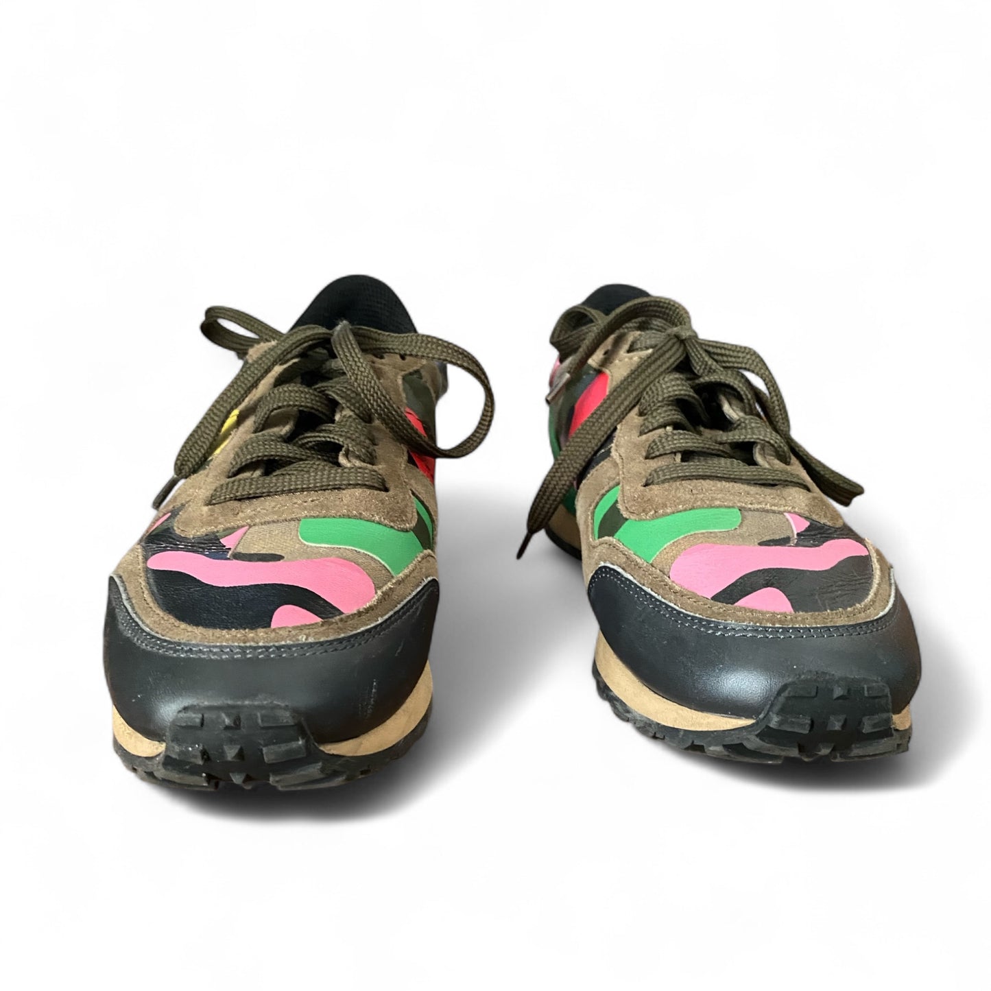 Valentino sneakers — heel view showing natural leather wear and scuffs from use