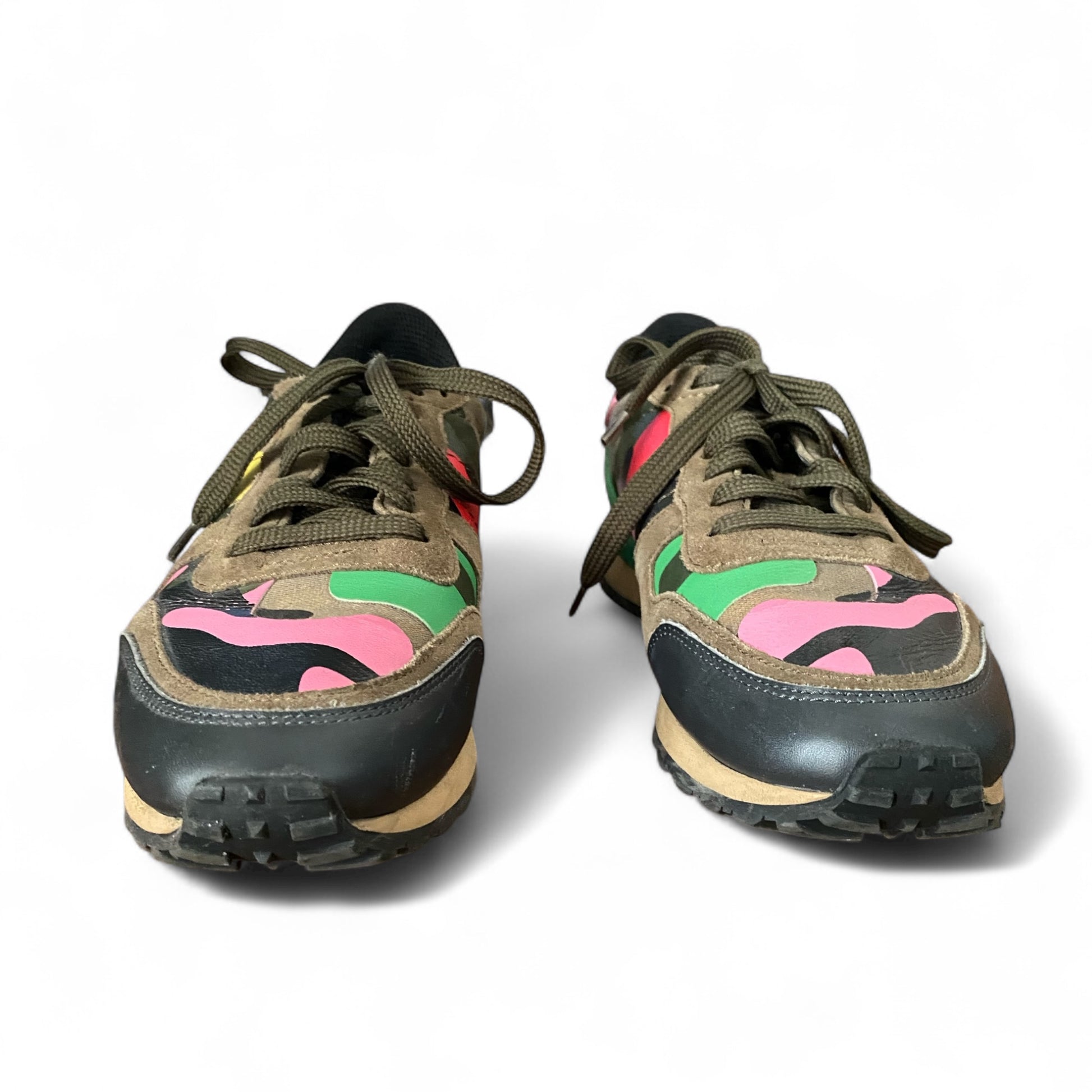 Valentino sneakers — heel view showing natural leather wear and scuffs from use