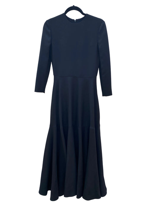 Valentino Wool Silk Crepe Black dress with long sleeves on a white fabric background