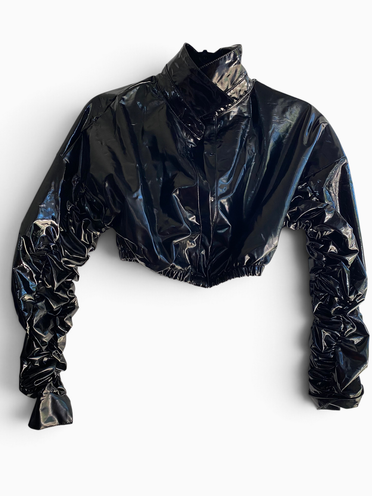 LaliSimone black shiny PU cropped jacket with a high collar and dramatic ruched sleeves on a white background