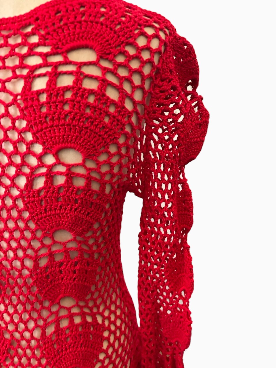 LaliSimone red crochet maxi dress featuring intricate openwork patterns and long sleeves with bell cuffs