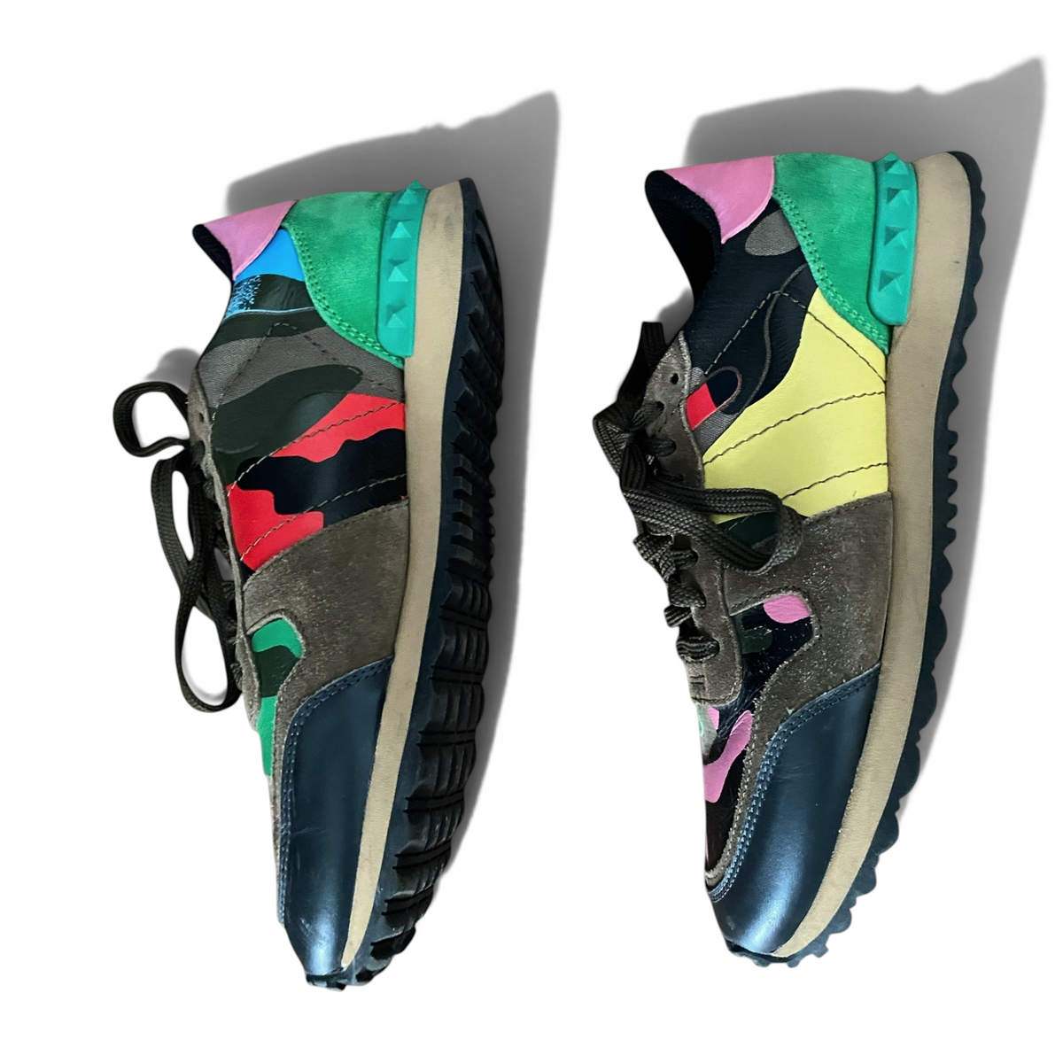 LaliSimone Valentino Garavani low top sneakers featuring a multi-colored camouflage pattern and signature stud details.