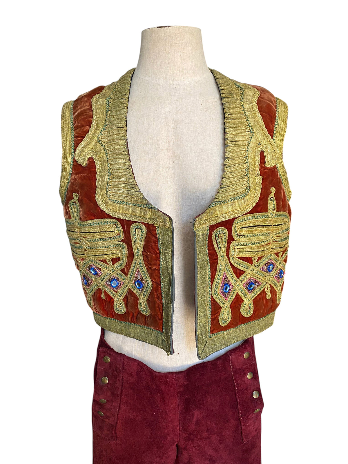 LaliSimone vintage rust-orange velvet vest with gold zardozi embroidery and shisha mirror work on a mannequin