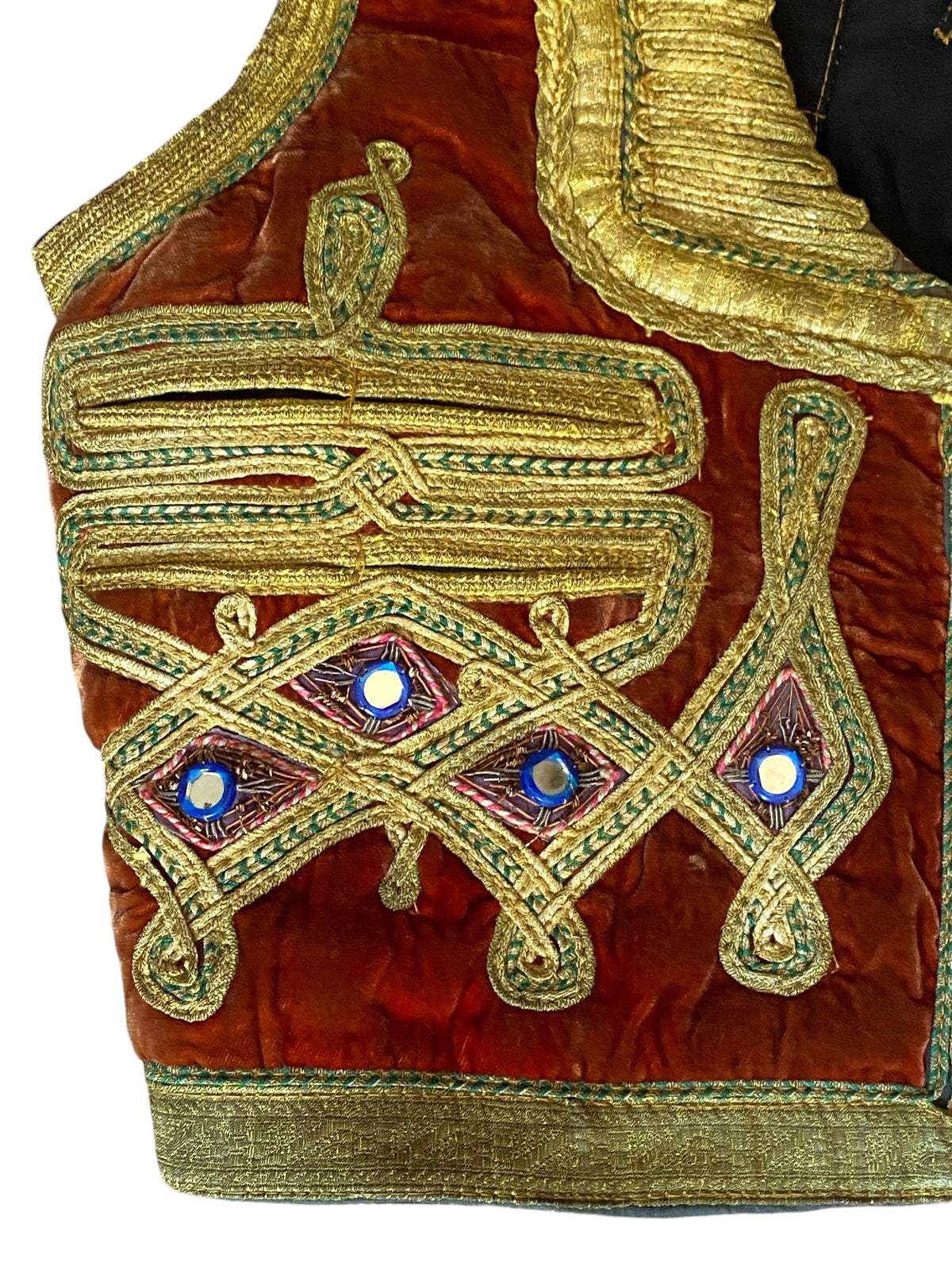 LaliSimone vintage rust-orange velvet vest featuring intricate gold zardozi embroidery and reflective shisha mirrors.
