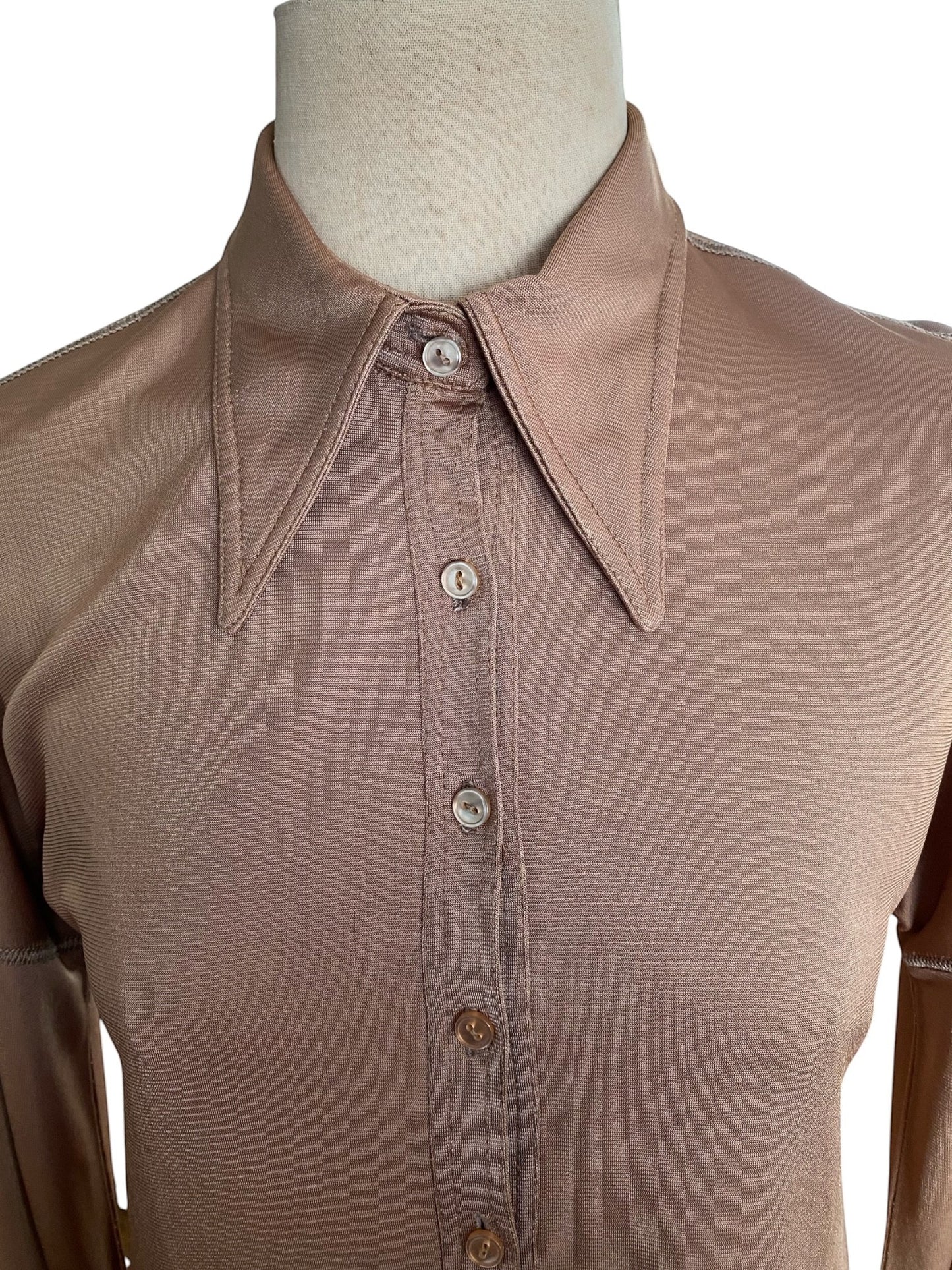 LaliSimone bronze jersey shirt dress with pointed collar and button front closure.