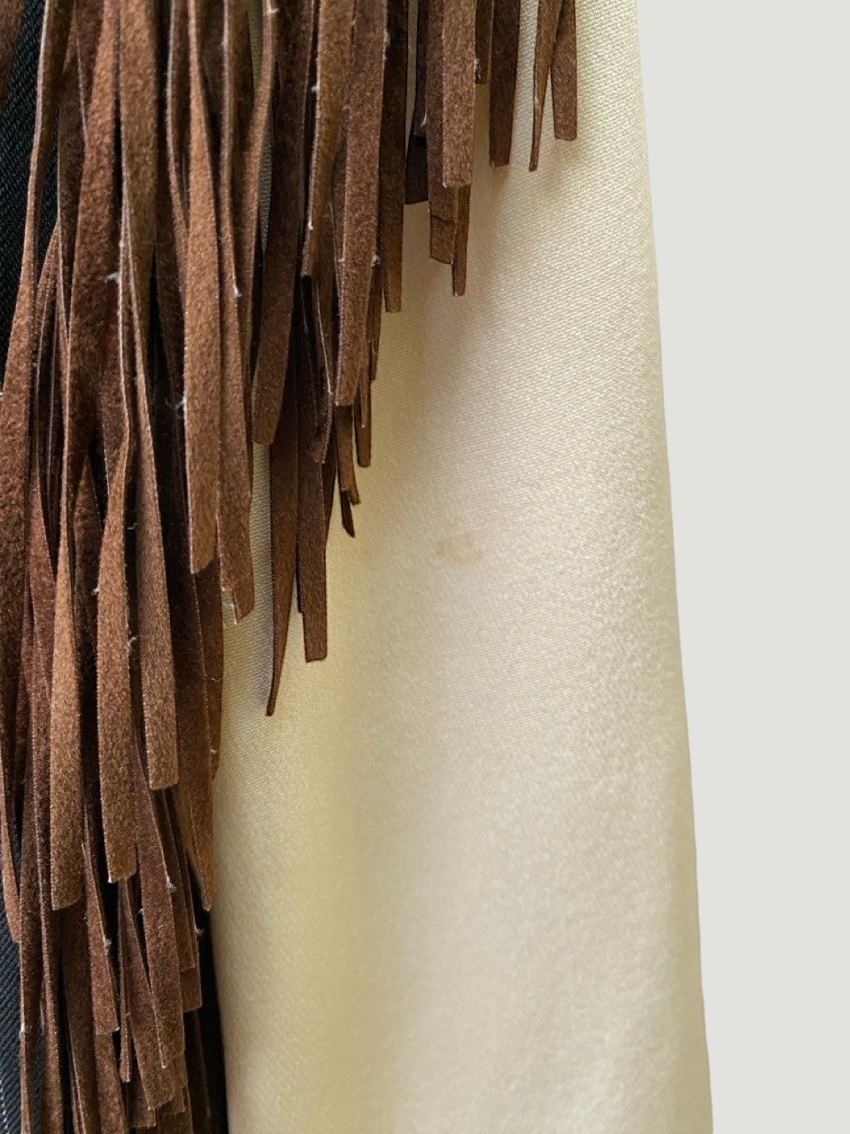 LaliSimone Ozbek jacket with brown suede fringe detail and cream fabric.