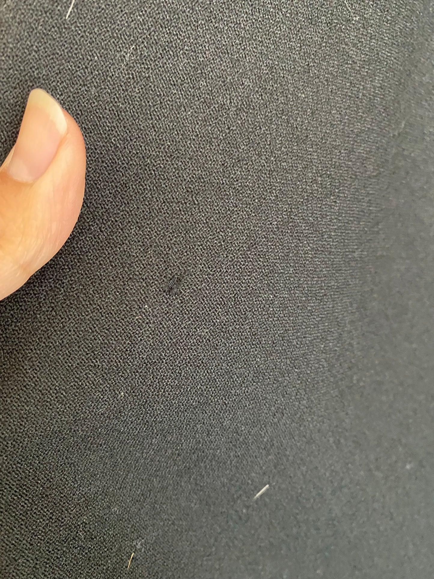 Archival Geoffrey Beene cocktail dress — condition detail showing moth holes on skirt