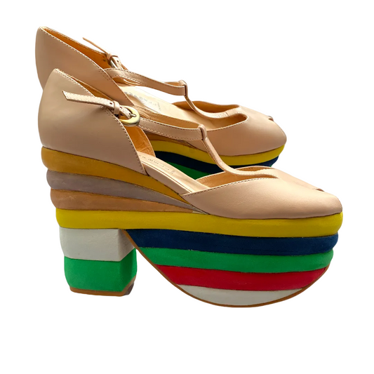 A pair of tan-colored, platform heel shoes with a rainbow layered design on the heel, featuring a peep toe style.